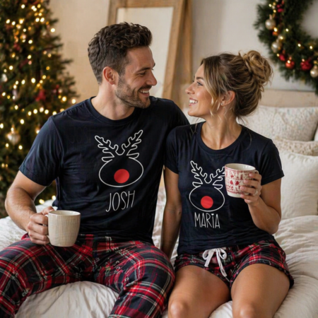 a couple wearing matching personalised rudolph pyjamas