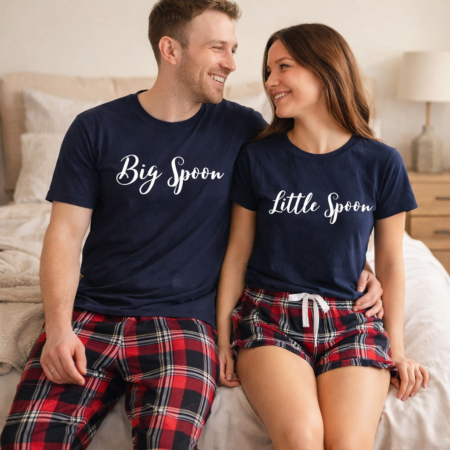 A couple wearing matching red and navy tartan pyjamas