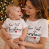 Mum and baby matching tops that say Our First Christmas