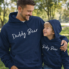 dad and son wearing matching hoodies that say Daddy Bear baby bear