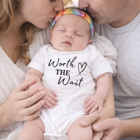 baby vest saying the words worth the wait
