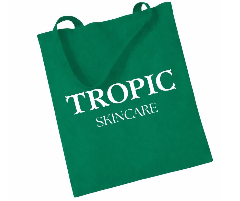 Tropic Skincare green tote bag with white logo, reusable branded skincare accessory.