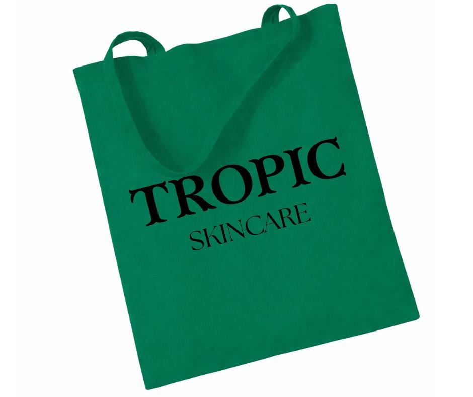 Tropic Skincare green tote bag with black logo, reusable branded skincare accessory.