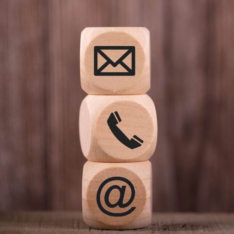 3 brown dice with the email telephone icons